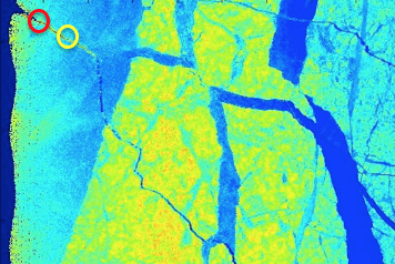 Bright blue, green, and yellow false-color image of a glacier with circles around the leads or cracks in the ice